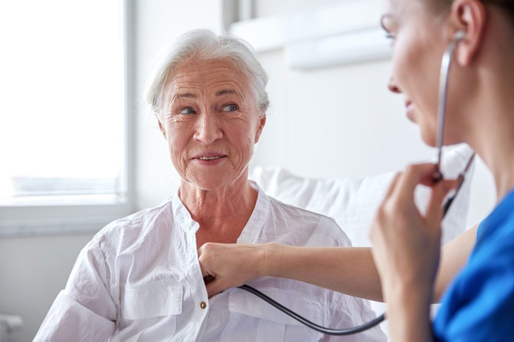 Doctor listening to woman's chest on World COPD Day