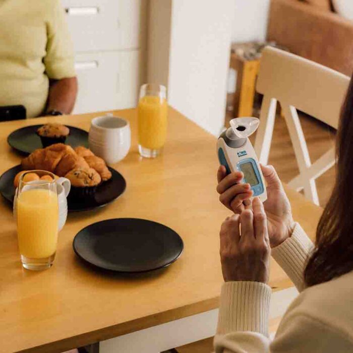 A Woman using a K-Series at breakfast