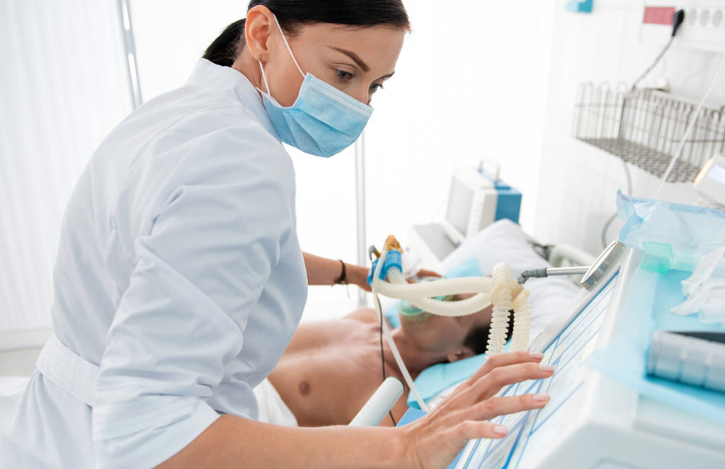 photo of medical professional treating patient