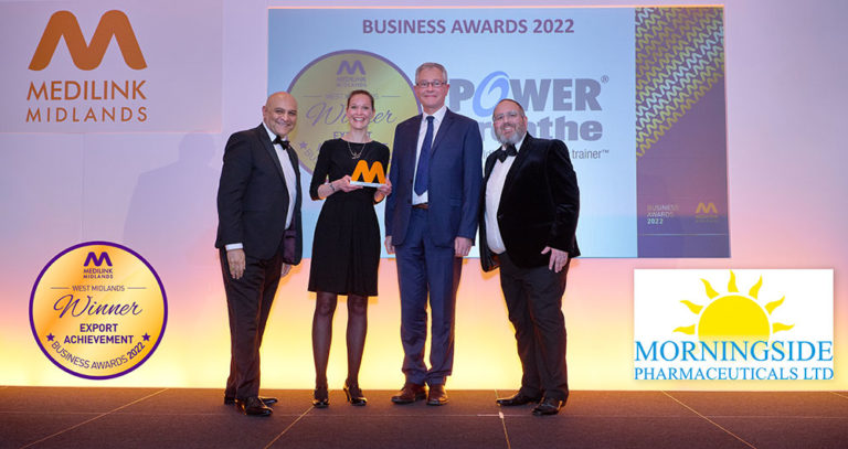 two people from POWERbreathe accepting business award on stage