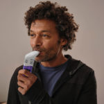 Heas and shoulders of a man using the EX1