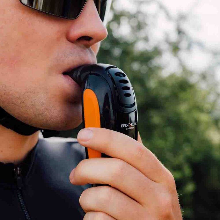 Close up side view of a cyclist using the K=-Series