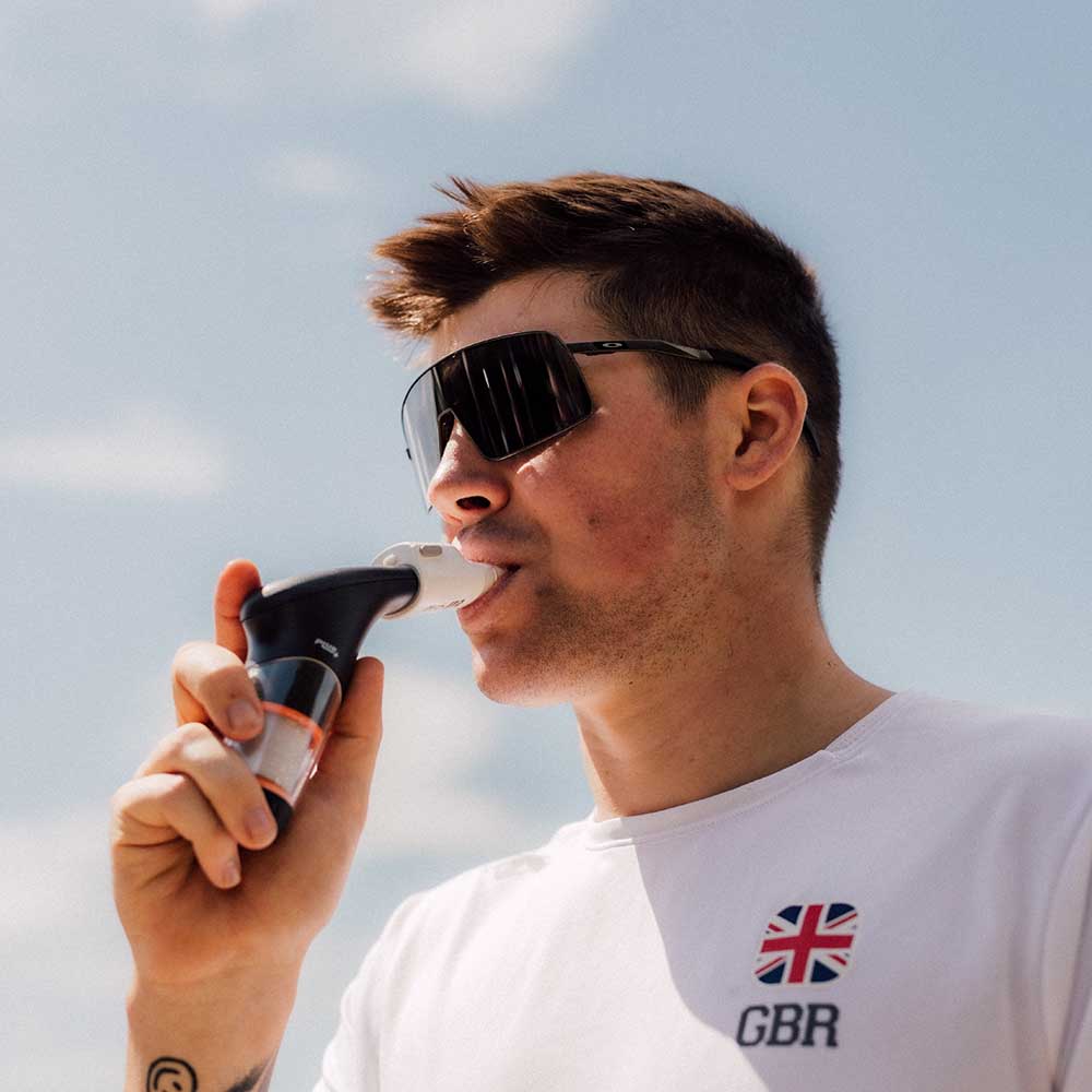 A close up of a man using the Plus and Smart Adaptor