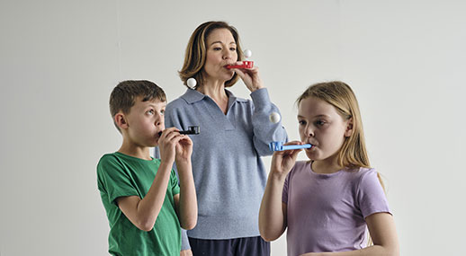People using Flow-Ball breathing device for breath control