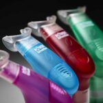 4 of the Plus standing on a table fanned out with a black background.