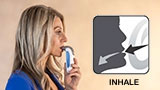 Headshot of person breathing through the POWERbreathe IMT device and diagram showing the direction of breath in