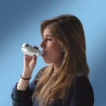 A woman using a Shaker Medic Plus