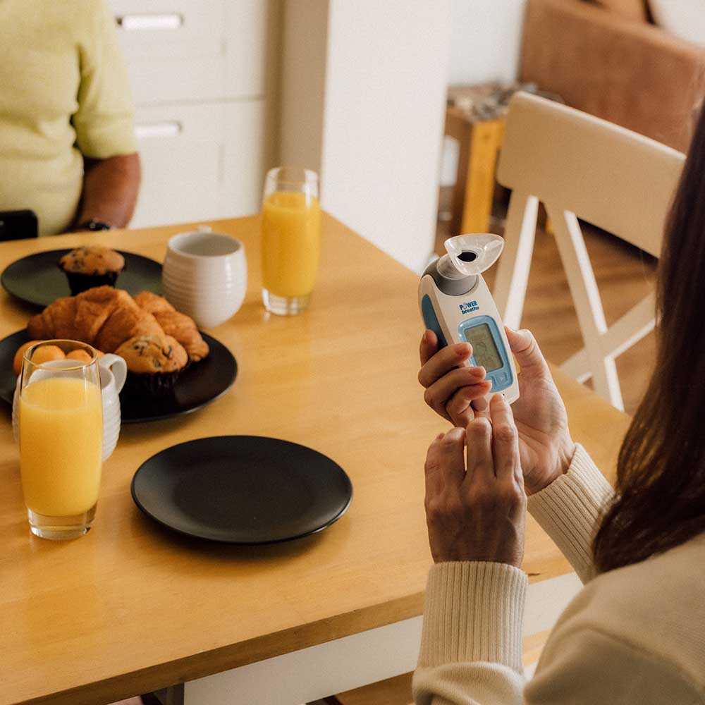 A Woman using a K-Series at breakfast