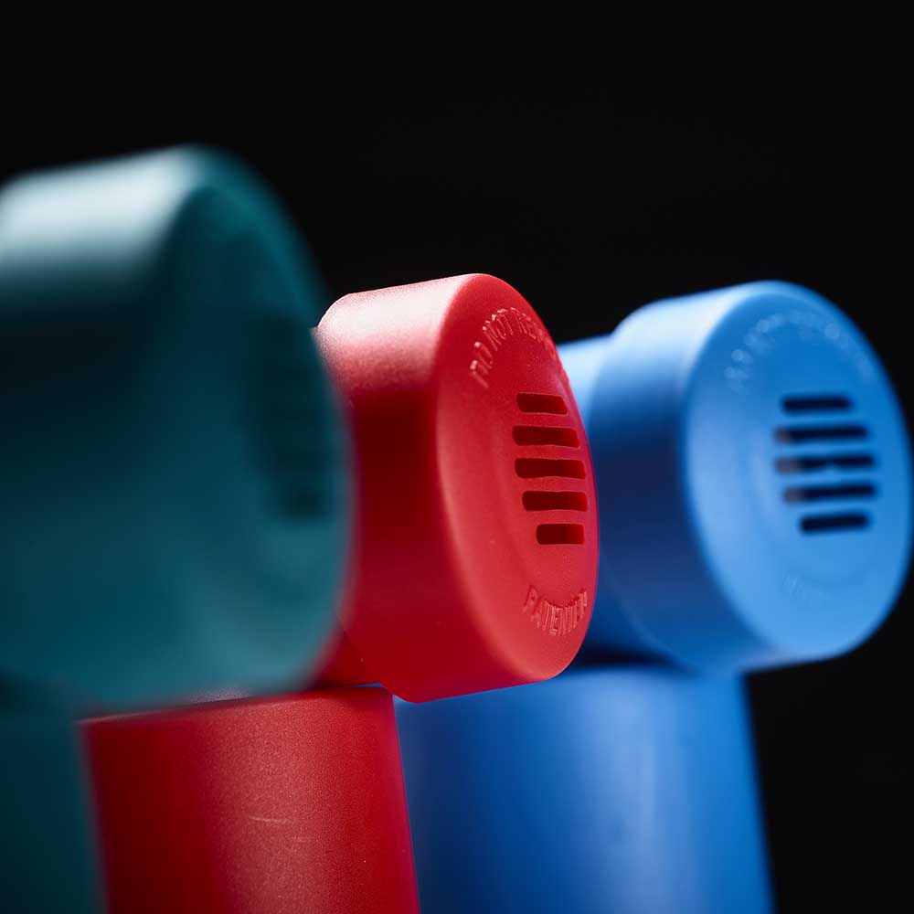 close up Back view of 3 of the Classic fanned out with a black background.