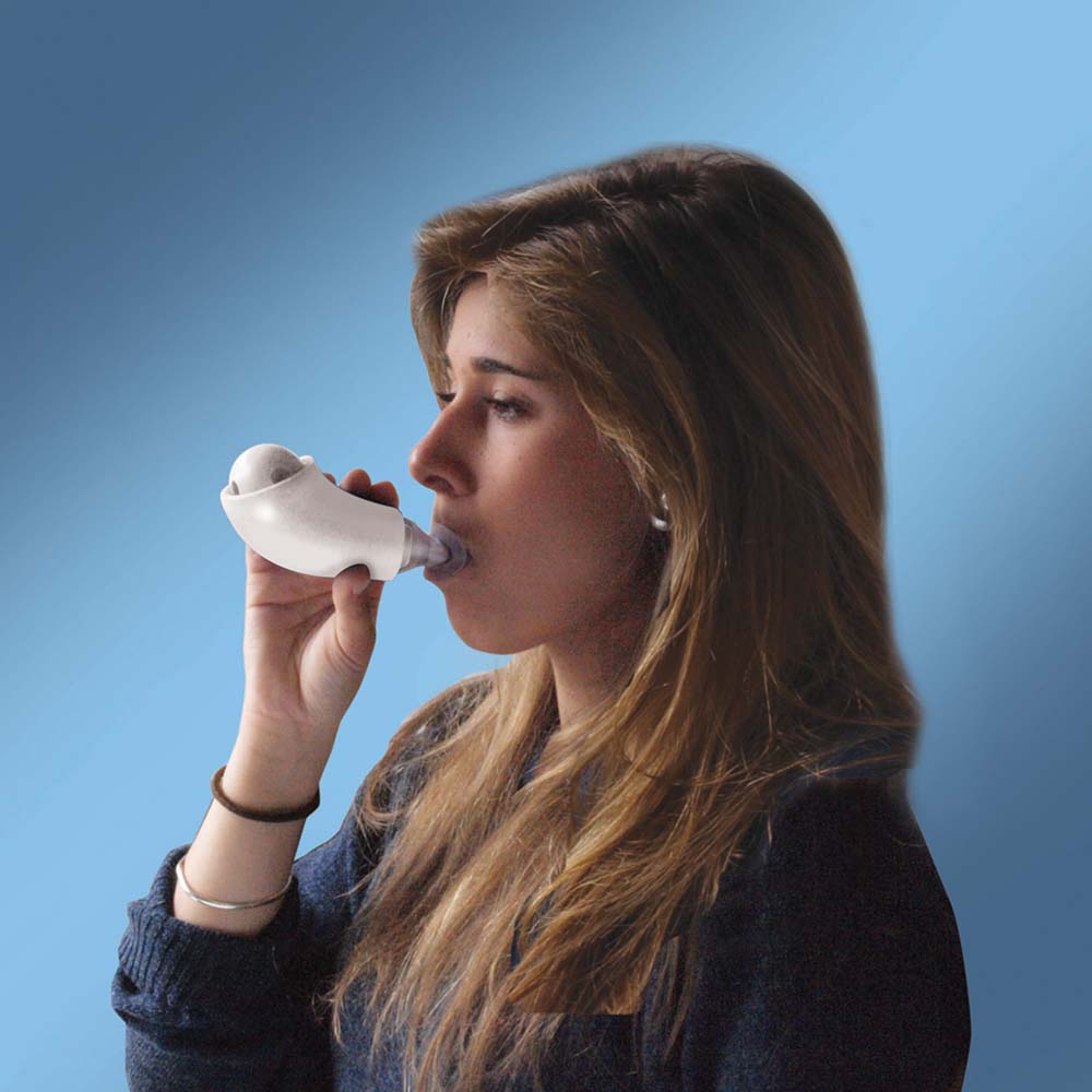 A woman using a Shaker Medic Plus